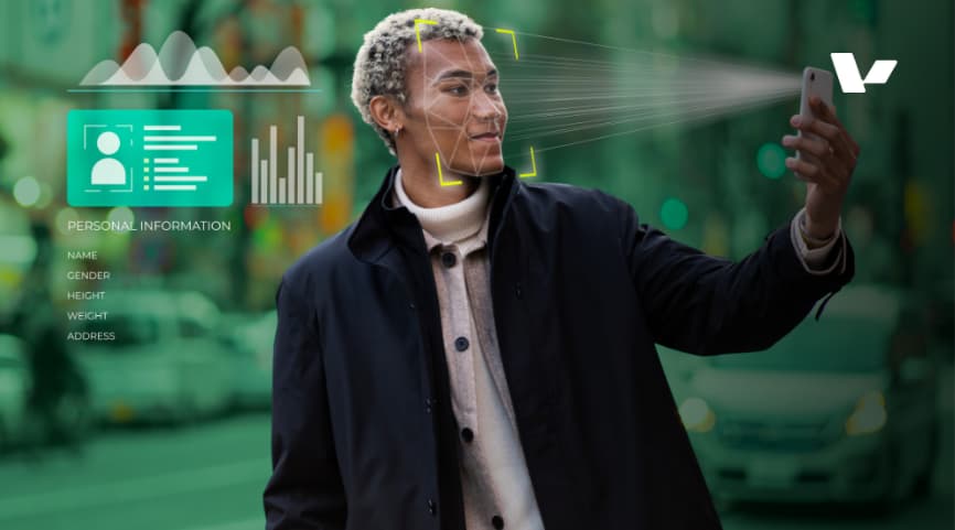 A person using facial recognition technology on their smartphone, with digital data like personal information and graphs overlaying the image, symbolizing the intersection of AI and personal data security.