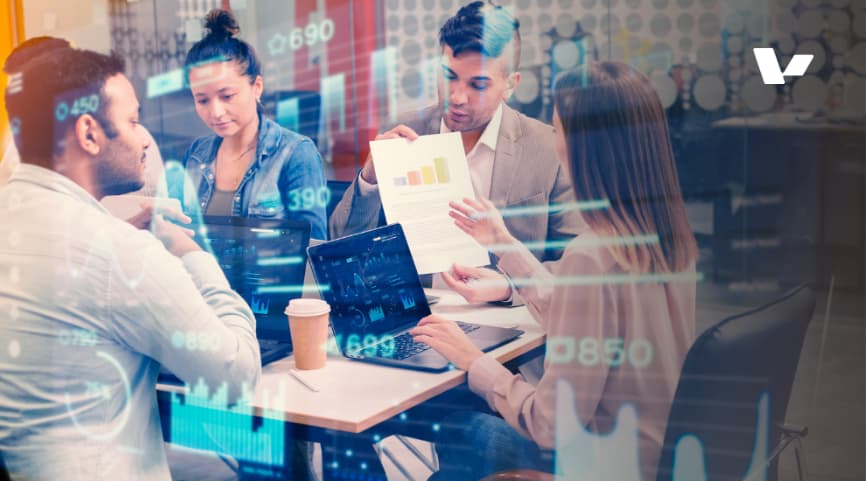 A business team discussing data insights and strategy during a meeting. 