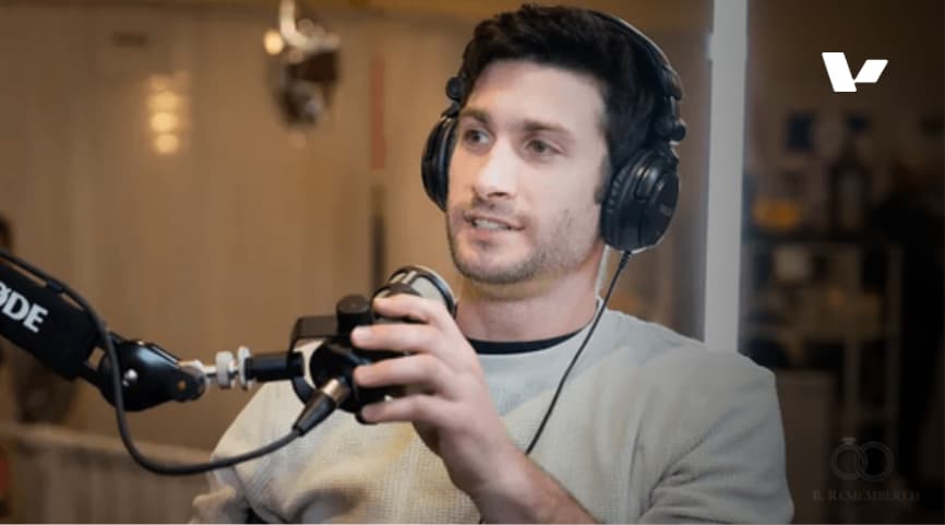 Guy Pistone, CEO of Valere, speaking into a microphone during a podcast interview, showcasing his expertise in business and technology.