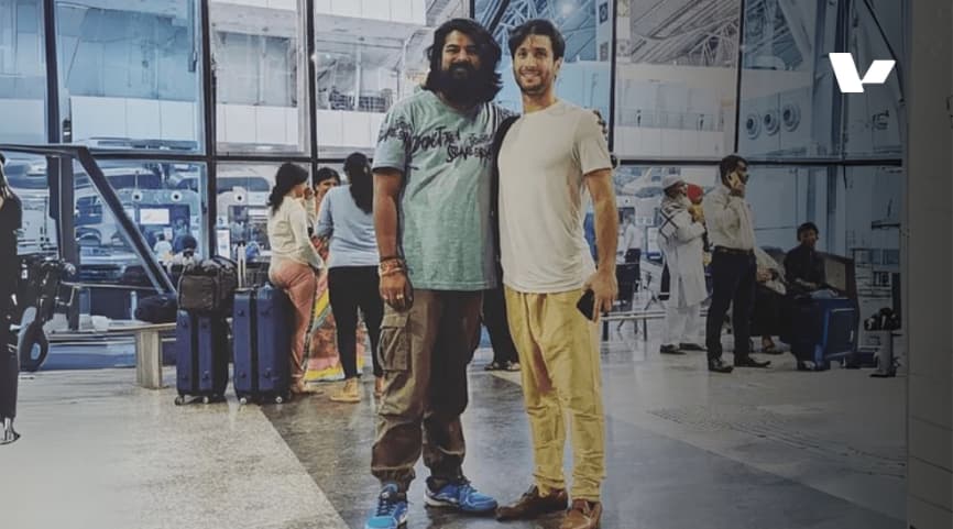 Anmol Upadhyay and Guy Pistone, co-founders of Valere, stand together at an airport, marking their first in-person meeting after years of working together remotely.